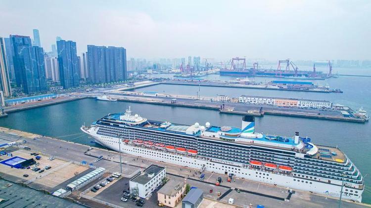 An aerial drone photo taken on May 27, 2025 shows cruise ship Adora Mediterranea docking at a port in Dalian, northeast China's Liaoning Province. (Xinhua/Pan Yulong)